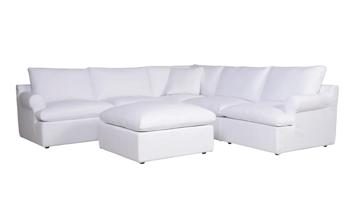 White modular sectional with ottoman